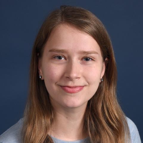 blue background and a woman's face in the middle