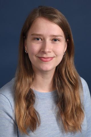 blue background and a woman's face in the middle