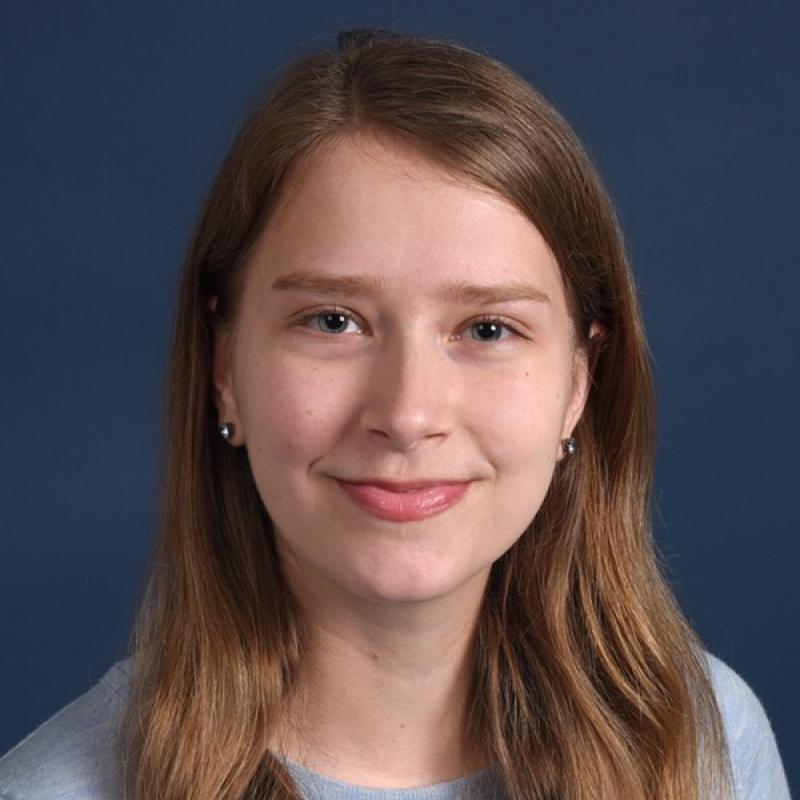 blue background and a woman's face in the middle